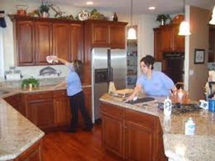 Cleaning crew working in a kitchen